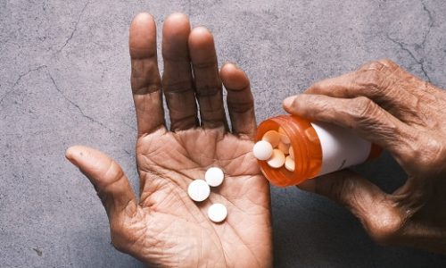 person-pouring-pills